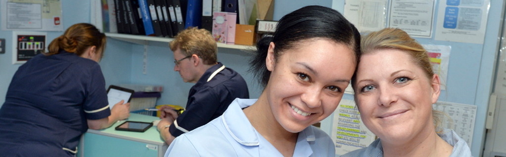 Nurses working and smiling Nurses working and smiling