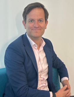 Rob sat smiling to camera