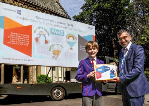 Dr Purav Desai presenting Freddie with his certificate