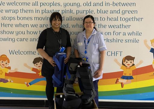 Hannah and Sahlee stood with some splints and braces in the department