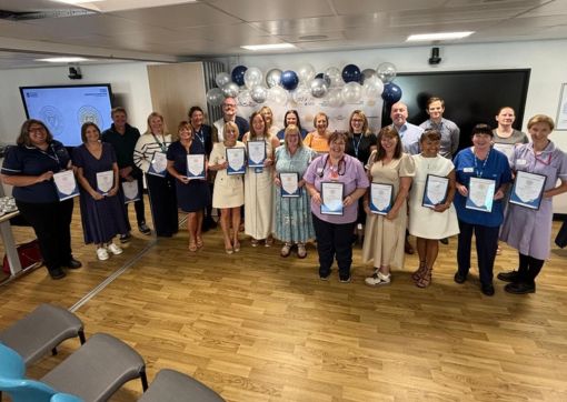 A group shot of all our recipients with their certificates
