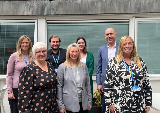 The Outpatient User Group team. Tom is pictured on the far right on the back row.