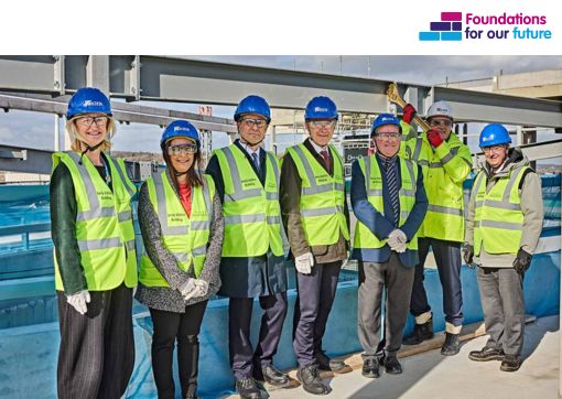 A photo of attendees at the Topping Out Ceremony at Huddersfield University