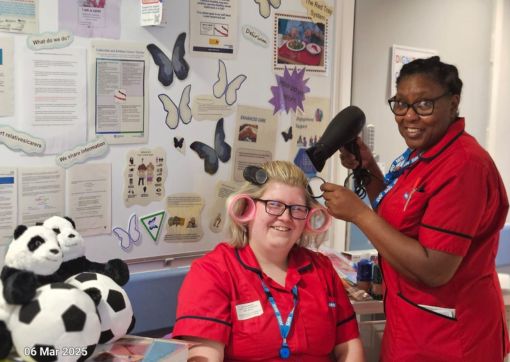 Our engagement support workers having some fun with the equipment they bought with donations