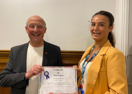 Phil receiving his award from Widening Participation and Volunteering Administrator, Charlie Singleton