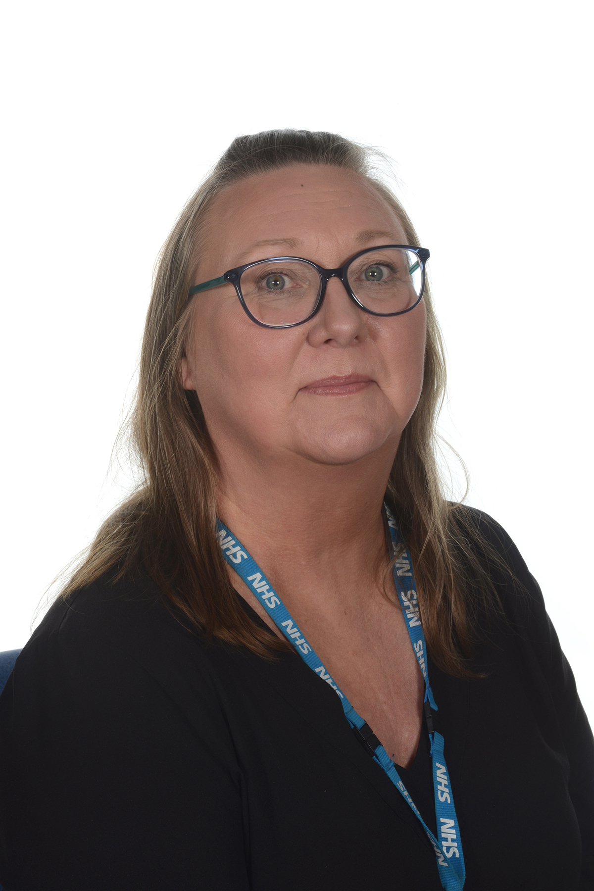 A person wearing glasses and in a black top.