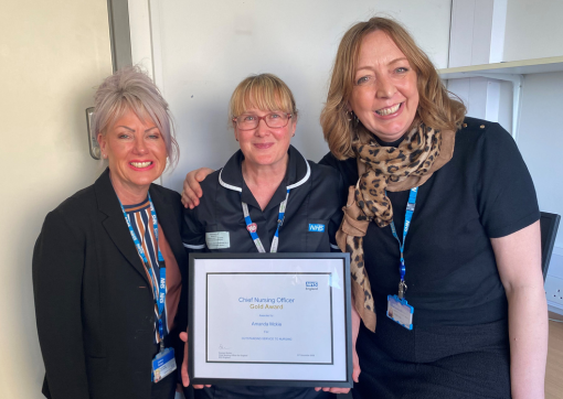 Amanda being presented the CNO Gold Award by Lindsay Rudge and Jo Middleton