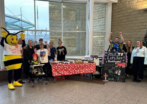 The CHFT Charity Team, NICU team and parents celebrating in the CRH main entrance