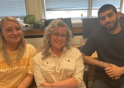 Sarah (middle) pictured with colleagues, Alexia Peacock (left) and Faris Ullah (right)