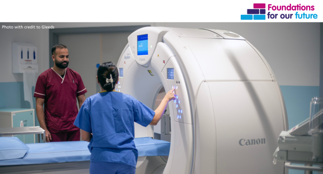 Colleagues next to a scanner in the CDC  - photo credit Gleeds