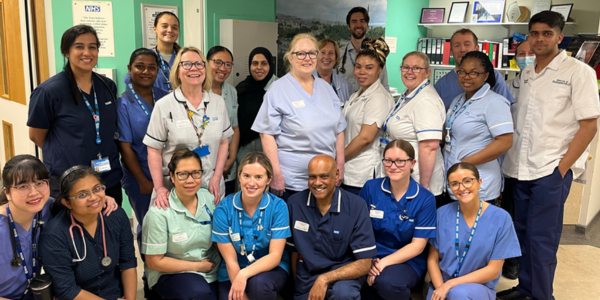 A large group of colleagues outside a ward