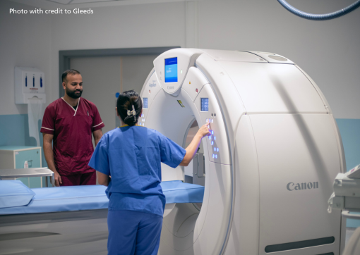 Colleagues by a scanning machine in the Southgate CDC - picture credit Gleeds