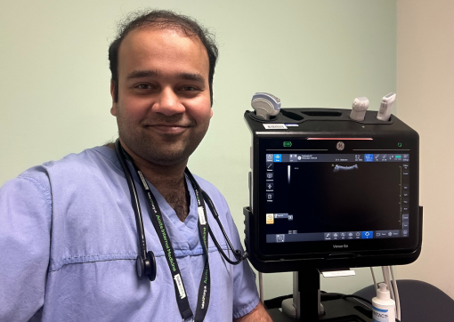 Acute Medicine Doctor, Husam Jamil, with an echo test machine