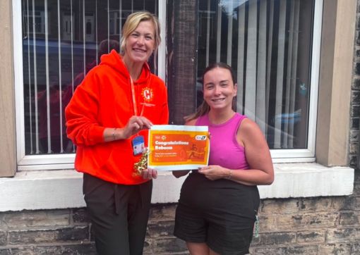 Rebecca is awarded her place by Head of Charity Emma Kovaleski