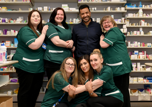 A group of colleagues smiling as a group from our Pharmacy Department