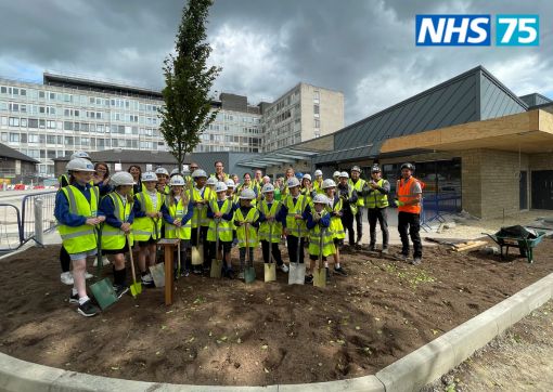 The children of Reinwood Junior School with colleagues at the tree planting