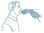 Two gloved hands holding some string going into a person's mouth