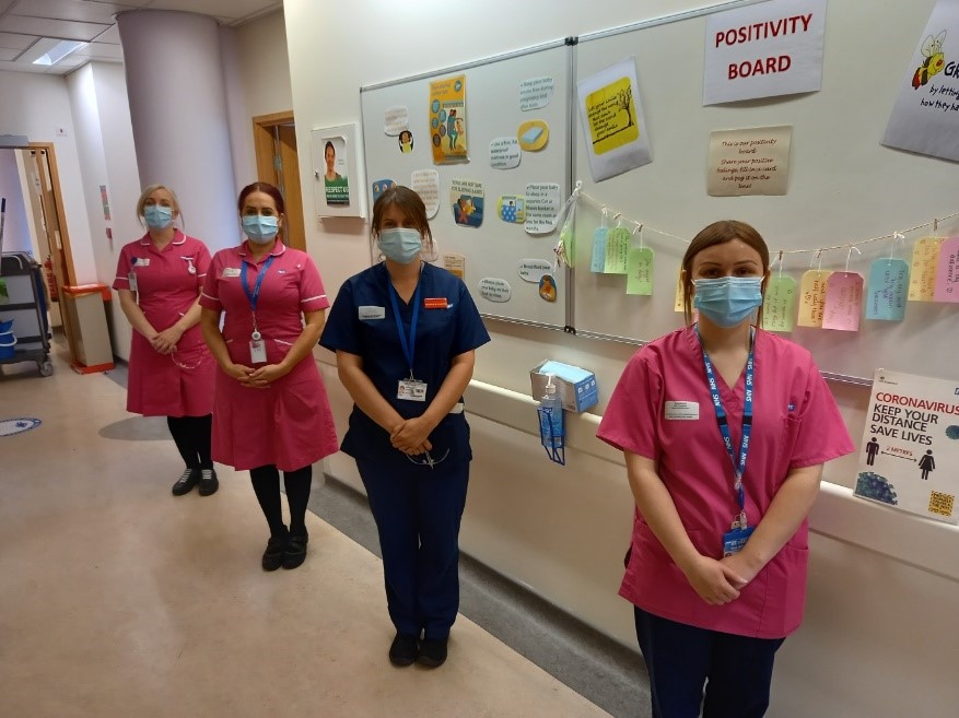 3 Midwives dressed in pink and one labour Ward Coordinator