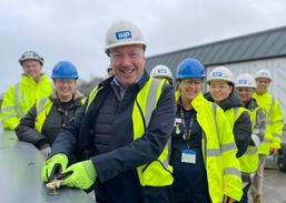 Chief Executive Brendan secures the bolt with Trust colleagues and our partners at Vinci Construction