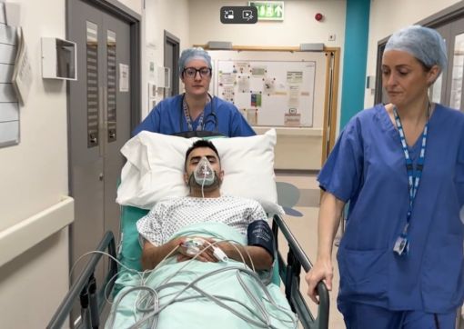 A screenshot from one of the videos showing a Toseef being taken in a trolley from theatre