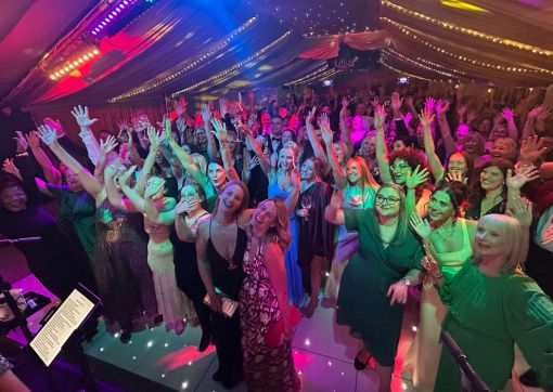 Guests gathered on the dance floor to music by Sass & The Groove