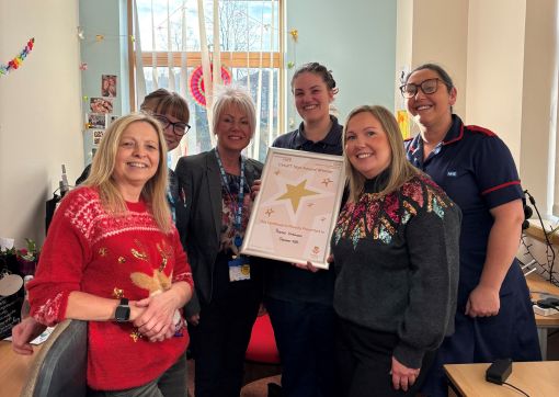 Rachel (third from the right) being presented with her award