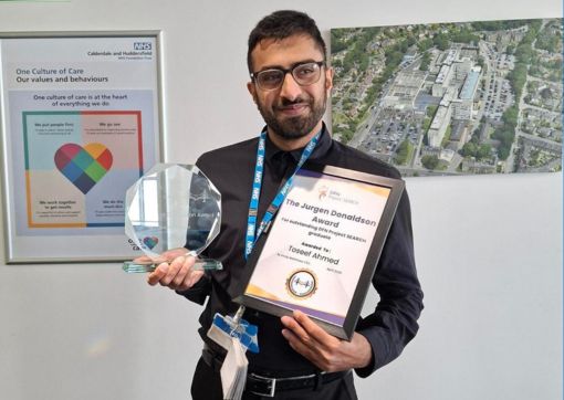 Toseef with his award at Acre Mills