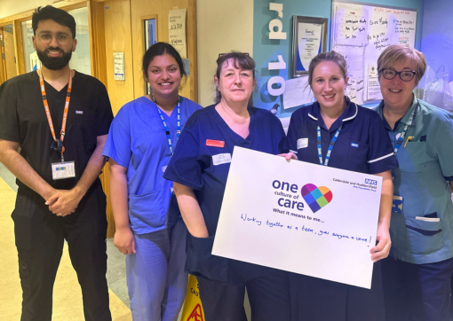 A group of our colleagues smiling on a ward at Huddersfield Royal Infirmary